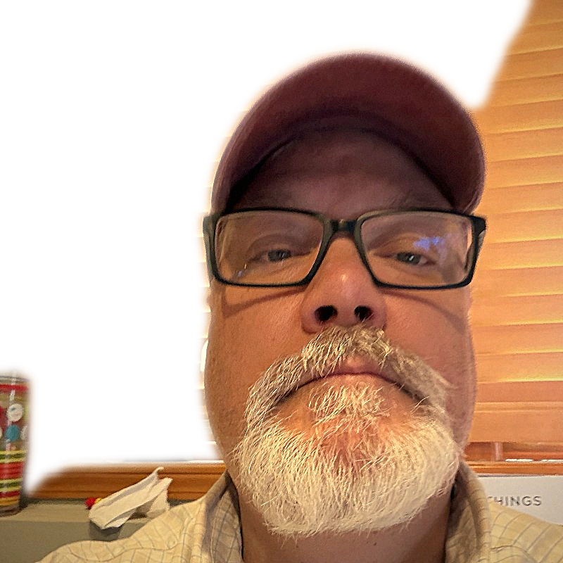 Tom chin-up in a red cap