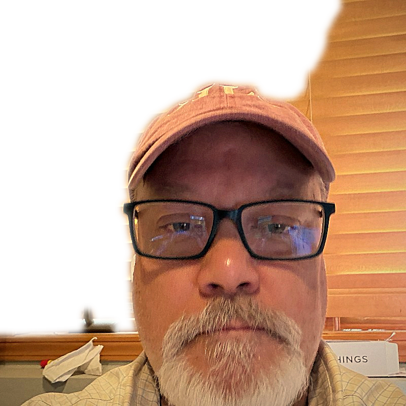 Tom straight-on in a red cap