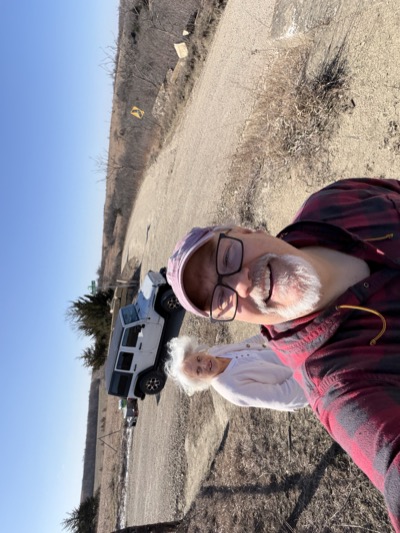 Family beside an off-road vehicle