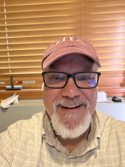 Tom in a cap and glasses