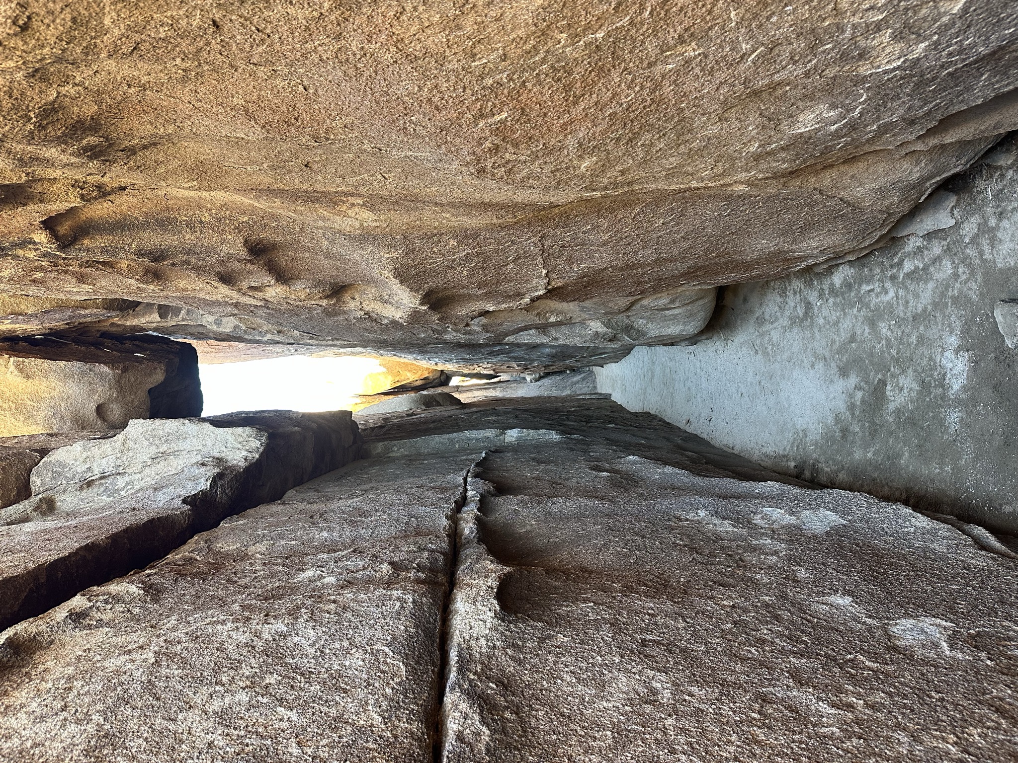 A narrow granite slot passage in the desert.
